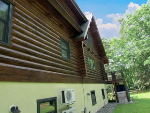log home back side stained and waterproofed